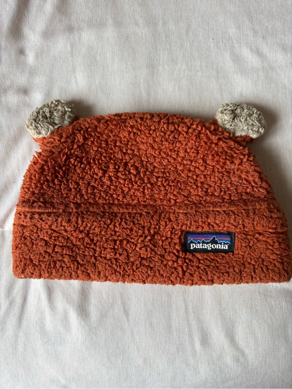Patagonia Sherpa Beanie in Burnt Orange with Cream Tag